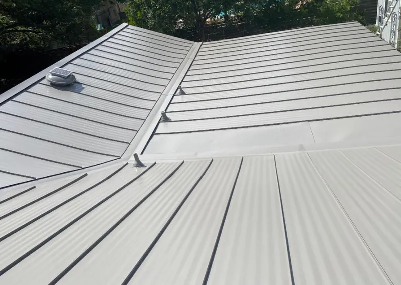 Solar attic fan installed on a metal roof for Roof Ventilation in Corvallis